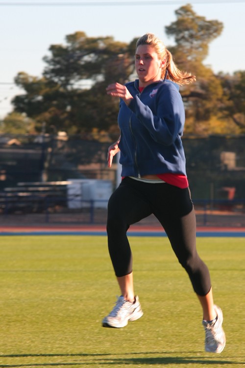 Gordon Bates / Arizona Daily Wildcat

Julie Stupps, former UofA swim team member, is seen training at the running field. She is doing warm up exercises in preparation for a 40 minute run that is immediately to follow.