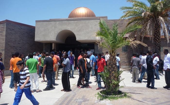 Dozens of worshipers file out of the Islamic Center of Tucson following their weekly ?jummuah,? or Friday prayer, which Muslims observe worldwide every week. About 600 people on average attend services.