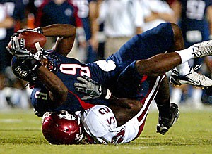 UA wide receiver Anthony Johnson is tackled by a Washington State defender during the Wildcats 48-20 victory over the Cougars last Saturday at Arizona
