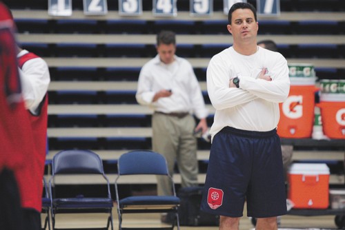 Arizona men?s basketball head coach Sean Miller looks on at practice on Oct. 22 at McKale Center. In his first season as head coach, Miller will have his chance to implement his coaching style and leave his mark on the program.