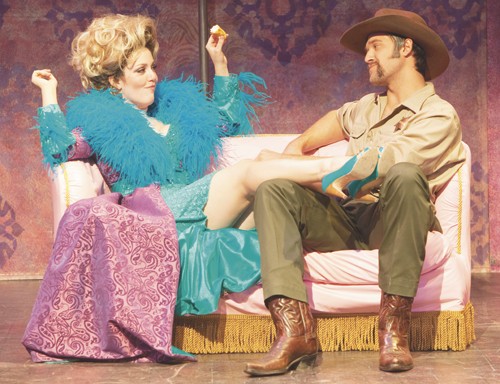 Miss Mona Stangley (Angela Bray) and Sheriff Ed Earl (Brad Kula) perform a scene from the UA?s production of ?The Best Little Whorehouse in Texas? on the couch 