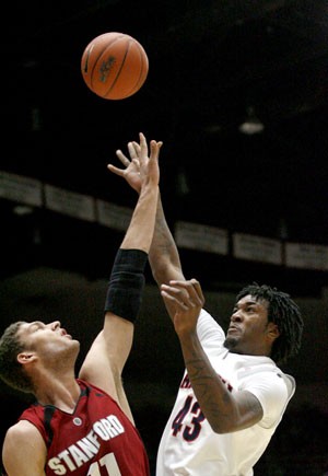 Arizona forward Jordan Hill shoots the ball over Stanford forward Brook Lopez in the Wildcats 67-66 loss to the Cardinal. The Wildcats are tied for fifth in a jumbled-up Pac-10 race.