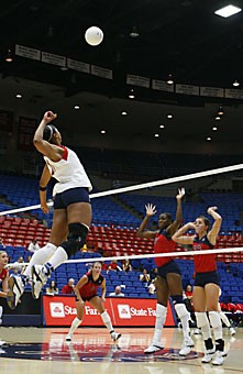Arizona outside hitter Whitney Dosty goes up for kill in game one of the annual Red/Blue intrasquad scrimmage yesterday in McKale Center. Dosty, who is nursing a knee injury, had eight kills in 22 attempts. 