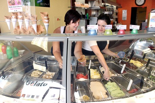 Lisa Beth Earle/ Arizona Daily Wildcat

Carla Pursel and her daughter Krystal Adams, owners of Cafe Italiano, serve up some fresh gelato on Tuesday, March 23. The cafe, located on the NW corner of Swan and Grant, makes all of its gelato and sorbeto in-house from fresh local ingredients.