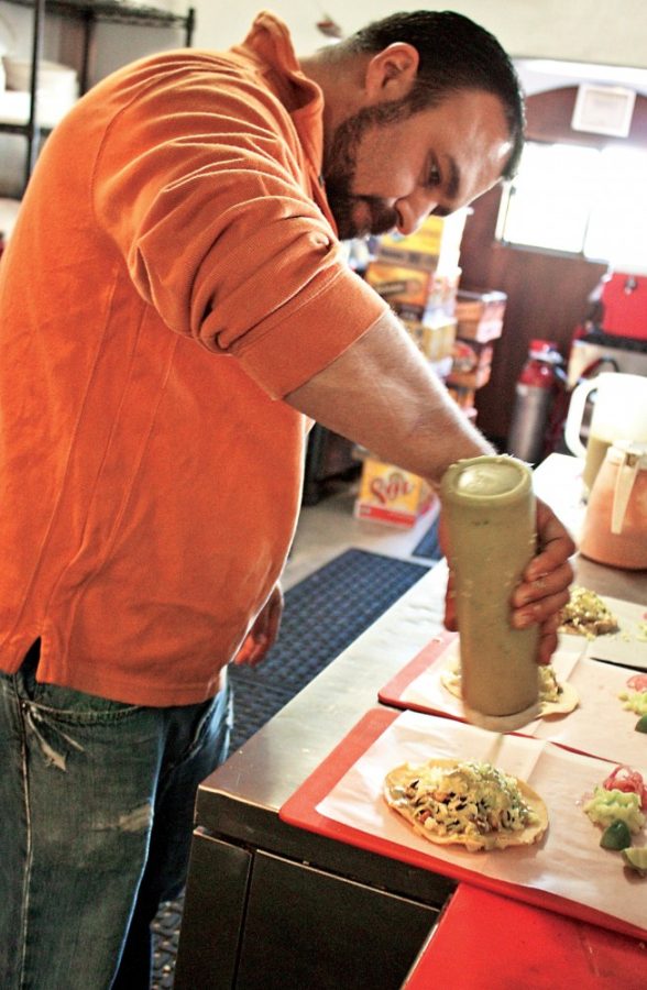 Bryan Mazon, owner of Boca Tacos and Tequila, serves up some octopus, Puerco Verde, and salmon tacos Tuesday, Jan. 25, 2011. Boca is known for their ?exotic? food options that, of recent, has included African lion meat. 