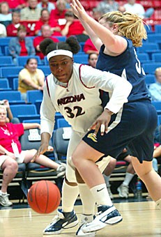 Forward Amina Njonkou works around Vanguards Molly Pfohl in a 76-70 Wildcat win in McKale Center on Monday night. UA head coach Joan Bonvicini said the junior Njonkou is capable of averaging a double-double this season.