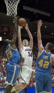 UA forward Chase Budinger goes up for a shot against UCLAs Luc Richard Mbah a Moute and Kevin Love during a 68-66 Bruin win on March 2, 2008 in McKale Center. Budinger has yet to beat UCLA during his time at Arizona, but can change that when the Wildcats face the Bruins at 9 p.m. in Los Angeles.