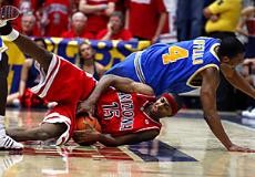 Arizona guard Mustafa Shakur is tripped up by UCLA guard Arron Afflalo during the second half of the No. 19 Wildcats 81-66 loss to the No. 5 Bruins Saturday in McKale Center. Shakur scored 17 points and passed out six assists in the Senior Day loss.