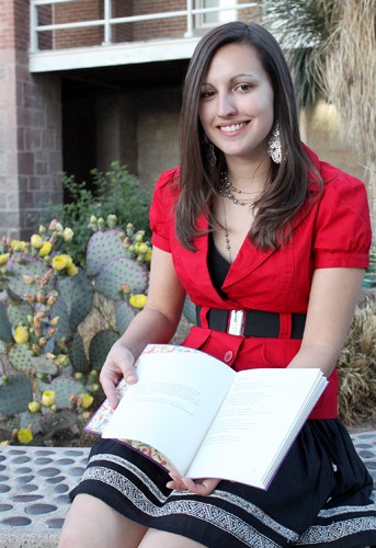 Lisa Beth Earle/ Arizona Daily Wildcat 

Julie Swarstad, a senior graduating with a Bachelor of Arts degree in creative writing, holds her handmade book of poetry, An Unacceptable Nearness, which she created for her thesis. She enjoys writing lyrical poetry with strong narrative elements and also played the trombone in the UA marching band, Pride of Arizona.