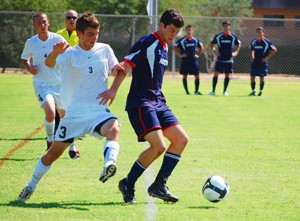 Arizona mens club soccer midfielder Sean Dunleavy fends off an NAU defender in Arizonas 4-0 win over the Lumberjacks. The mens club soccer team is now 5-0-3 in the season and will play two games in Las Cruces, N.M., on Saturday.