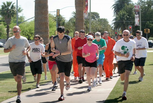 Valentina Martinelli /Arizona Daily Wildcat 

Students and faculty take off for the 5k run/walk as part of Dash for Darfur. The event was put on by a student division of an anti-genocide coalition, UA-STAND, next to the Hillenbrand Aquatic Center to raise awareness for Darfur.

