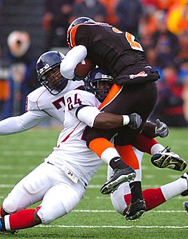 Junior linebacker Marcus Hollingsworth lifts Oregon State senior wide receiver Ruben Jackson off the ground during Arizonas 29-27 win over the Beavers last October in Corvallis, Ore. The Wildcats will have to rely on a defense that gave up 654 yards and forced six turnovers against the Beavers last year while the offense rests on the shoulders of third-string quarterback Kris Heavner.