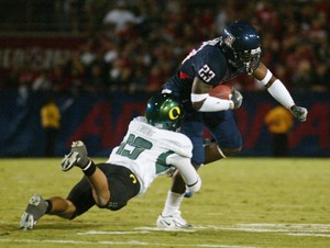 UA running back Nic Grigsby (23) breaks a tackle in last years 34-24 upset victory over then-No. 2 Oregon at Arizona Stadium. Over the past two years against the Ducks - both UA victories - the schools have developed a new rivalry on the gridiron.