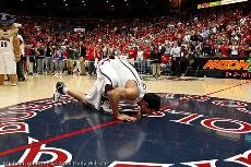 David Bagga kisses the floor of McKale Center after his final game in McKale Center. Bagga will participate in the NBA Development League tryouts this weekend.