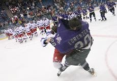 Former Icecats forward Dave Cwik tackles Weber State forward David Lorenzen before players could shake hands after Arizonas 2-1 win in 2005 in the Tucson Convention Center Arena. The night was filled with roughing penalties by both teams, raising emotions that culminated in several fights.