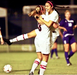 UA junior Samantha Drees, 3, and sophomore Karina Comacho celebrate an Arizona goal during a 4-0 win over Weber State at Murphy Stadium Friday night. Comacho had a goal and two assists on Friday, but couldnt help the Wildcats defeat No. 5 Texas in Austin last night as they fell 2-1 in overtime.