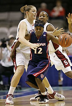 Stanford center Jayne Appel, left, and guard Candice Wiggins, right, defend Arizona guard Ashley Whisonant during the first half of a quarterfinals game in the Pac-10 Tournament in San Jose, Calif., Saturday. No. 1 seed Stanford beat No. 9 seed Arizona 65-55 to end the Wildcats season.