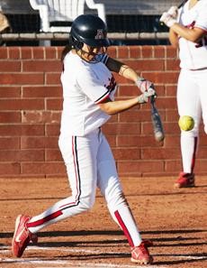 Arizona catcher Stacie Chamber (21) stares down a pitch during 20-1 win against UTEP on March 4 at Hillenbrand Stadium. Chambers, a junior, leads the NCAA with 23 home runs so far this season for the Wildcats.