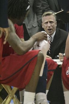 UA associate head coach Mike Dunlap talks to players on the mens basketball team during a break in an 83-60 loss at UCLA on Jan. 15.