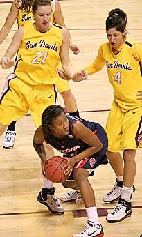 Arizona guard Joy Hollingsworth looks for an open teammate while being surrounded by a trio of Sun Devils in the Wildcats 89-62 loss to No. 10 ASU Friday in Wells Fargo Arena. Hollingworth tied forward Amina Njonkou for the team lead in points (14) and rebounds (seven). 