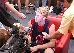 Freshman Chase Budinger is interviewed yesterday in the locker room in McKale Center.
