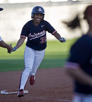 Arizona left fielder Brittany Lastrapes rounds third base after smacking a three-run homer in the first of two games against Team Canada at Hillenbrand Stadium last night. The Wildcats won the series opener 8-5 but dropped the nightcap 6-4.