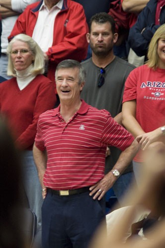 Tim Glass / Arizona Daily Wildcat

President Robert Shelton stands to cheer on the mens basketball team during a game against Washington Jan. 1, 2010.