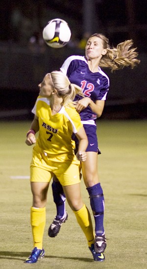ASU forward forward Carla Scanniello (7) and UA defender Savanah Levake fight for an airborne ball in a 2-1 Wildcat win in Tempe on Friday.