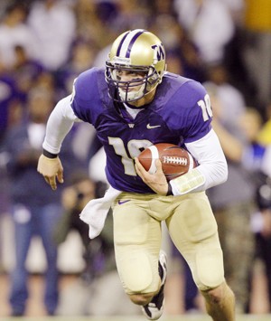 Washington quarterback Jake Locker carries the ball against Stanford in the first quarter Saturday in an NCAA college football game in Seattle.