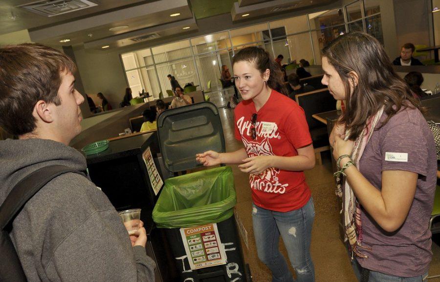 Alex Kulpinski / Arizona Daily Wildcat

Microbiology major Hollie Mills and Hydrology major Chelsea Kestler volunteer with Compost Cats Monday afternoon at Sabor restaurant in the Student Union Memorial Center.  Hollie and Chelsea donate their time teaching students about composting because it is a great cause and it is incredibly easy to compost food.