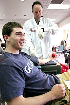 Jake Lacey/ Arizona Daily Wildcat

Pre-business sophomore Ricky Tribble gets blood drawn during a blood drive at the Kappa Sigma fraternity house yesterday. The American Red Cross filled the 25 unit quota for the event.