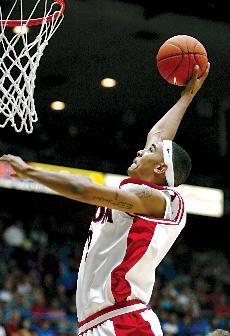 Former Wildcat Marcus Williams dunks for two of his game-high 25 points in a 111-56 win over the University of Victoria in an exhibition game in McKale Center Nov. 8. Williams was drafted by the San Antonio Spurs Thursday and will play for the team this summer before launching his NBA career.