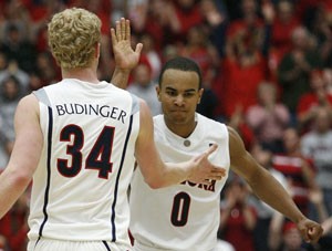 Arizona guard Jerryd Bayless congratulates forward Chase Budinger in the Wildcats 67-66 loss to then-No. 7 Stanford in McKale Center on Feb. 16. UA interim head coach Kevin ONeill said if either thinks he has a chance to be top-10 NBA draft pick in June, he should go pro.