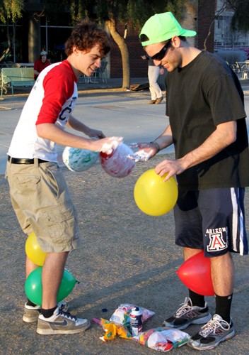 Lisa Beth Earle / Arizona Daily Wildcat

Sigma Chi fraternity members Daniel Tellez, an engineering freshman, and Collin MacCabe, a psychology freshman, carefully slather shaving cream on balloons to prepare them for a balloon shaving contest. The contest was one of many that various sorority members competed in during Derby Days.