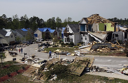 Tornado damaged homes on Serendipity Drive in northeast Raleigh, North Carolina can be seen, Tuesday, April 19, 2011. Cleanup continues in many parts of central and eastern North Carolina following dozens of tornadoes that hit the state on Saturday. (Chris Seward/Raleigh News & Observer/MCT)