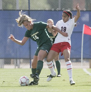 UA forward Renae Cuellar fights for the ball with Oregon defender Darcie Gardner during a 1-0 Wildcat loss Sunday at Murphey Field. Arizona beat Oregon State 2-1 on Friday.