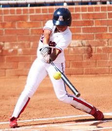 UA sophomore Brittany Lastrapes connects with a pitch during a 7-6 Arizona win against Oregon on March 29 at Hillenbrand Stadium. Arizonas offense struggled last weekend against Washington and UCLA as it scored four total runs.
