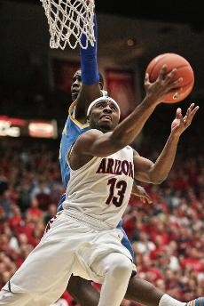 UA guard Nic Wise drives to the hoop during an 84-72 Arizona win against No. 11 UCLA on Saturday in McKale Center. Wise scored a game-high 26 points to lead the Wildcats to their seventh-straight win and first against the Bruins in their last nine tries.