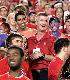 UA President Robert Shelton, the first person in his family to graduate from a university, stands in the Zona Zoo student section during the Wildcats 16-13 win over Brigham Young University Sept. 2 at Arizona Stadium.