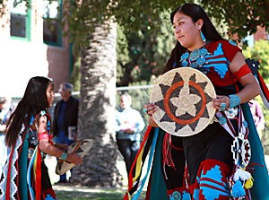Teshina Yazzie of the Dineh Tah Navajo Dancers from Albuquerque, N.M., performs the Basket Dance at the Southwest Indian Art Fair Saturday afternoon outside the Arizona State Museum.