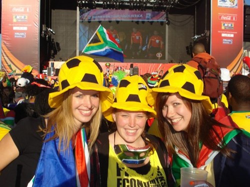 Hermien Arends, Emily Hendershot and Susan Paardekam stand in front of the live broadcasting of a FIFA World Cup Soccer game in Cape Town, South Africa. Hendershot is studying at the University of Stellenbosch in South Africa for fall semester.