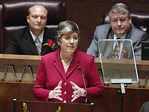 Arizona Gov. Janet Napolitano, center, presents her state of the state address to the Legislature Monday in the state House of Representatives building in Phoenix. At left is Senate president Tim Bee and at right is Speaker of the House Jim Weiers.