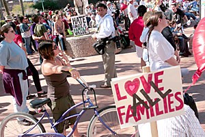 Tucsonans listen to speakers at the Rally for Love and Justice sponsored by Wingspan and Arizona Together. The rally was held in El Presidio Park yesterday to celebrate love and families, and express opposition to the Marriage Amendment that may appear on the November election ballot.