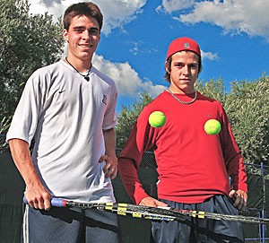Jason, left, and Alex Labrosse bounce the ball off their rackets at practice Oct. 9 at the Robson Tennis Center. Alex, a redshirt freshman, joined his older brother on the Wildcat tennis team. The Quebec natives still speak French to each other. 