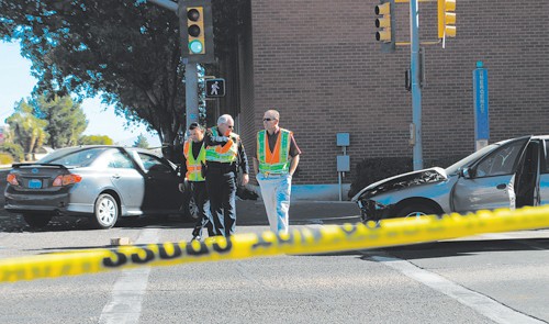 Valentina Martinelli/ Arizona Daily Wildcat

Police survey the scene of an accident at 2nd and Speedway on Wednesday Dec 1, 2010.  A pedestrian was injured in the accident and is in critical condition.