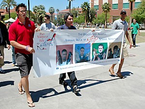 Mechanical engineering sophomore Andrew Leonard, left, an unidentified male and physiological sciences junior Moe Naqvi walked down the UA Mall wearing womens high heels yesterday to help raise awareness of sexual assault. 