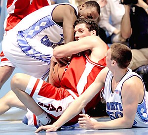 UA senior forward Ivan Radenovic fights for a loose ball between North Carolina forwards, Tyler Hansbrough, right, and Marcus Ginyard in Arizonas 86-69 loss last season in Chapel Hill, N.C. on Jan. 28. Hansbrough scored 21 points and grabbed 11 rebounds and may be tough to stop for Arizonas small front line.