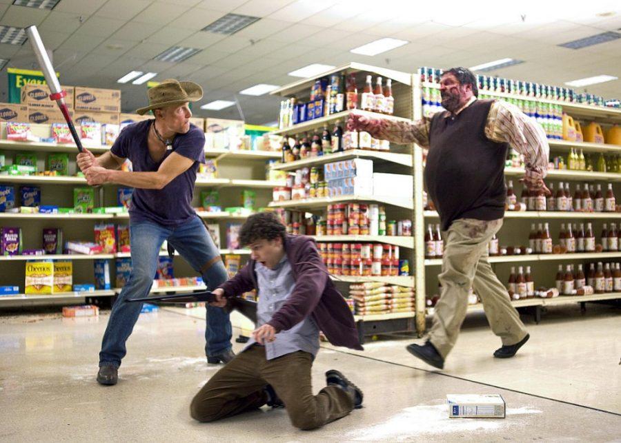 Woody Harrelson (left) and Jesse Eisenberg (center) star in Columbia Pictures ZOMBIELAND.