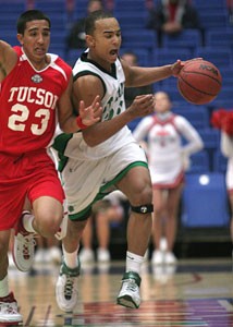 UA signee Jerryd Bayless, a St Marys High School senior, drives down the court past Tucson High School junior Rojer Castro during the No. 3 Knights 66-61 loss in McKale Center last night. Bayless, ranked as the nations No. 10 overall recruit, had a poor shooting game, hitting just 5-of-22 field goals and 1-of-10 3s.