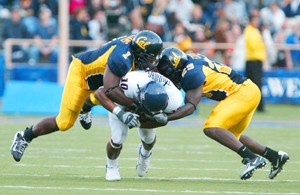 UA wide receiver Mike Thomas, center, gets sandwiched by two California defenders in a 45-27 Golden Bear win in Berkeley, Calif., on Sept. 22, 2007. The Wildcats take on Cal, which is in first place in the Pac-10, at Arizona Stadium Saturday night at 7.